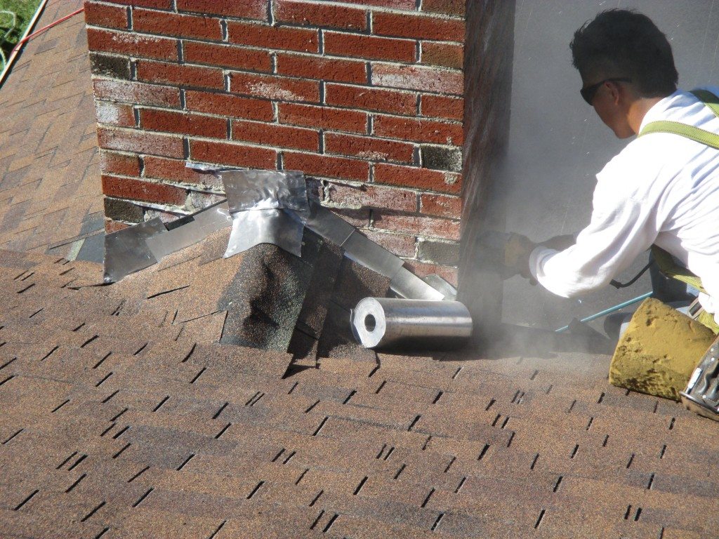 Chimney flashing and roof ventilation system ensuring durability and protection from leaks.