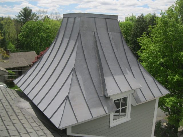 Homeowner pleased with the results of a completed roof replacement project.